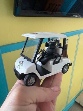 White Cow Driving Golf Cart with Miniature Accessories